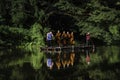 Monks come to offer alms by coming through the water by punting on bamboo rafts along the river at O Ã¢â¬â¹Ã¢â¬â¹Poi Market